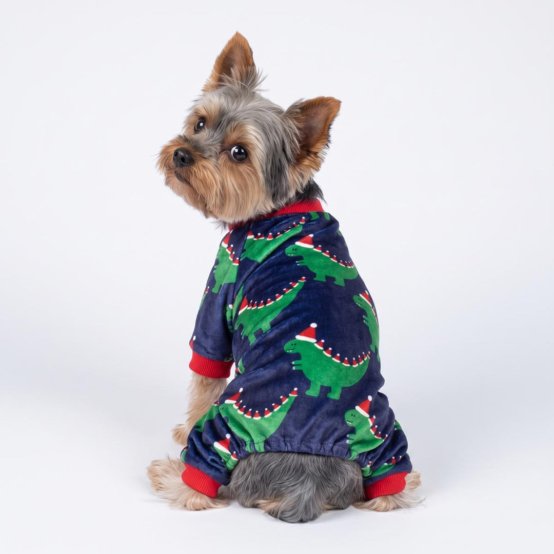 Back view of Yorkie wearing a santa hat dinosaur Christmas pajamas for dogs