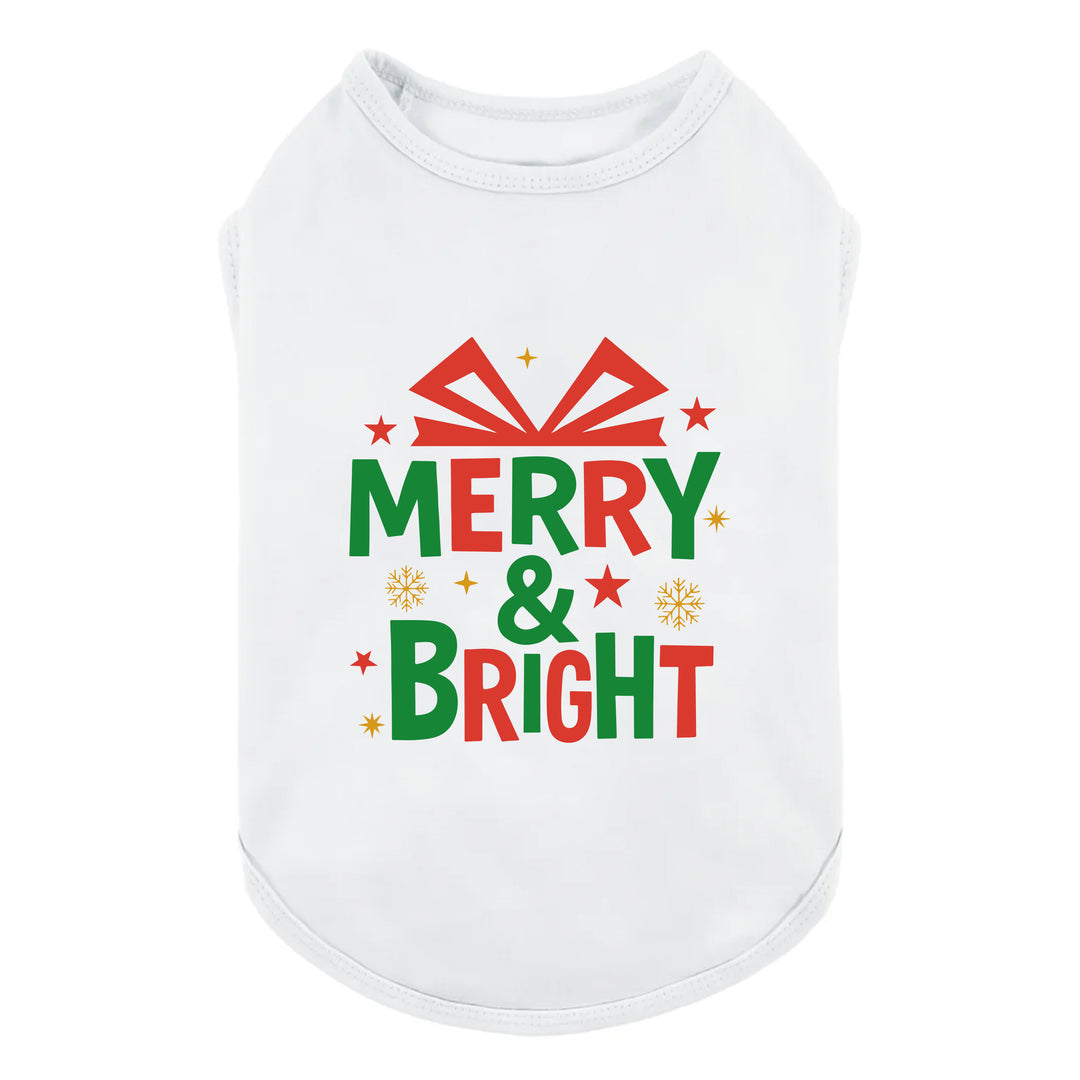 White dog shirt featuring colorful Merry & Bright holiday graphic with stars and snowflakes.