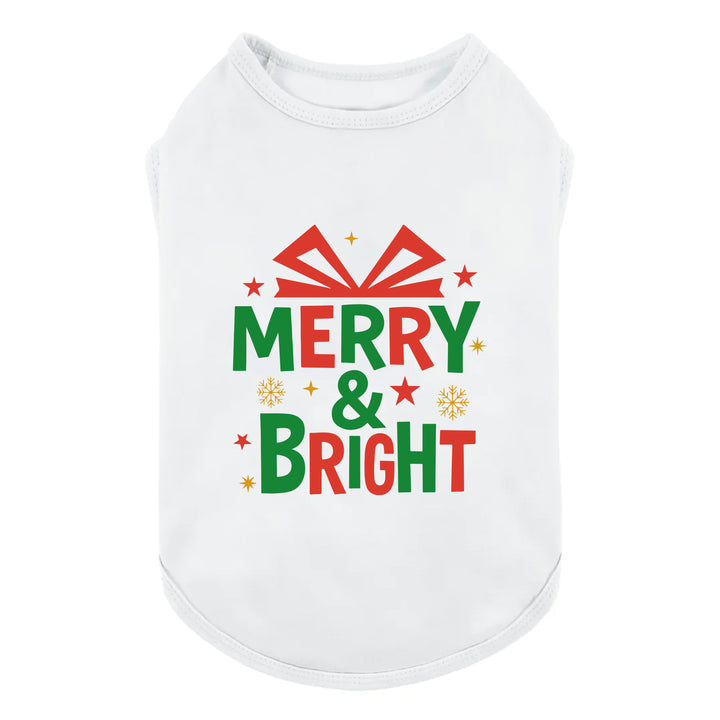 White dog shirt featuring colorful Merry & Bright holiday graphic with stars and snowflakes.